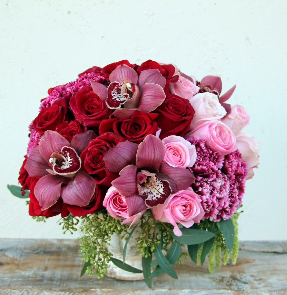 Red And Pink Roses And Orchids